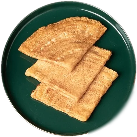 Folded Somali flatbreads on a green plate