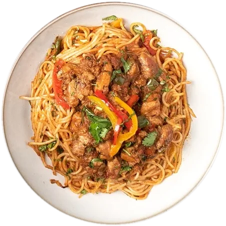 Pasta Soldato: spaghetti with meat, peppers and coriander on a white plate